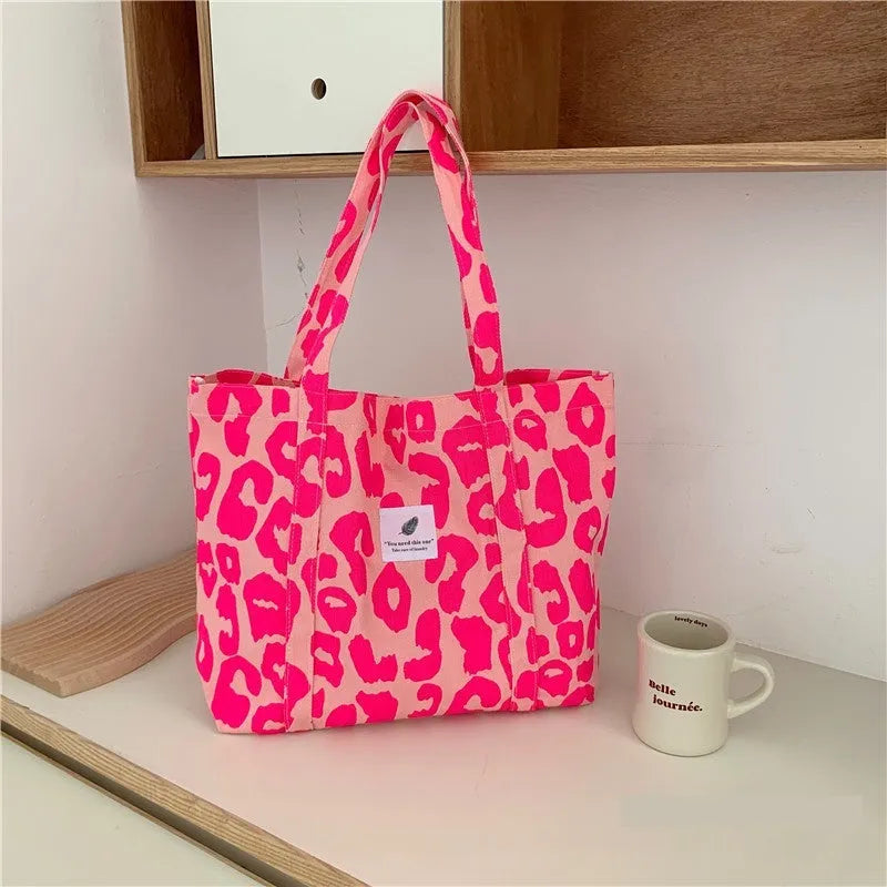 Large capacity Oxford cloth shoulder bag for women with a three-dimensional front pocket.