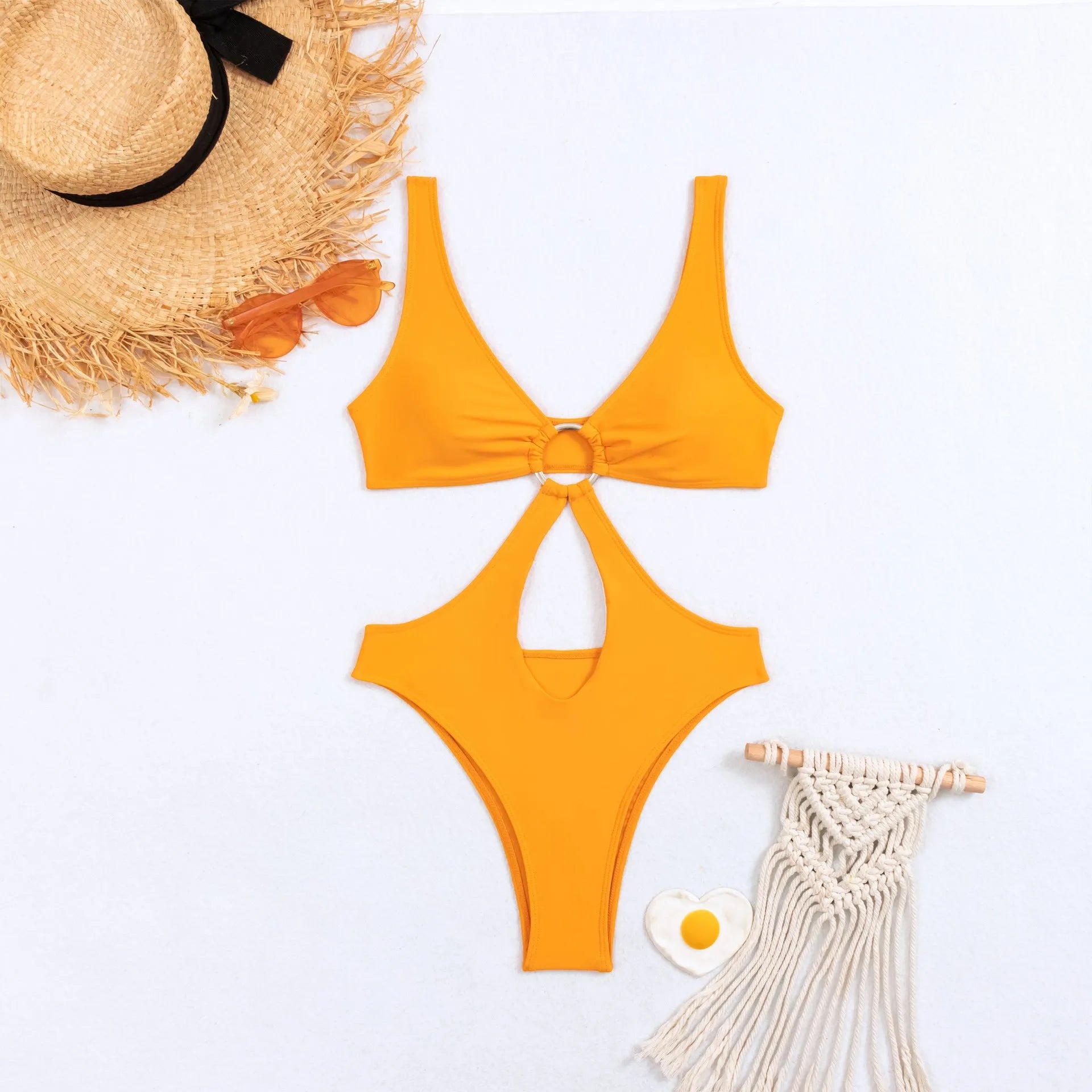 Black women's sleeveless triangle one-piece swimsuit made from nylon fabric on a mannequin.