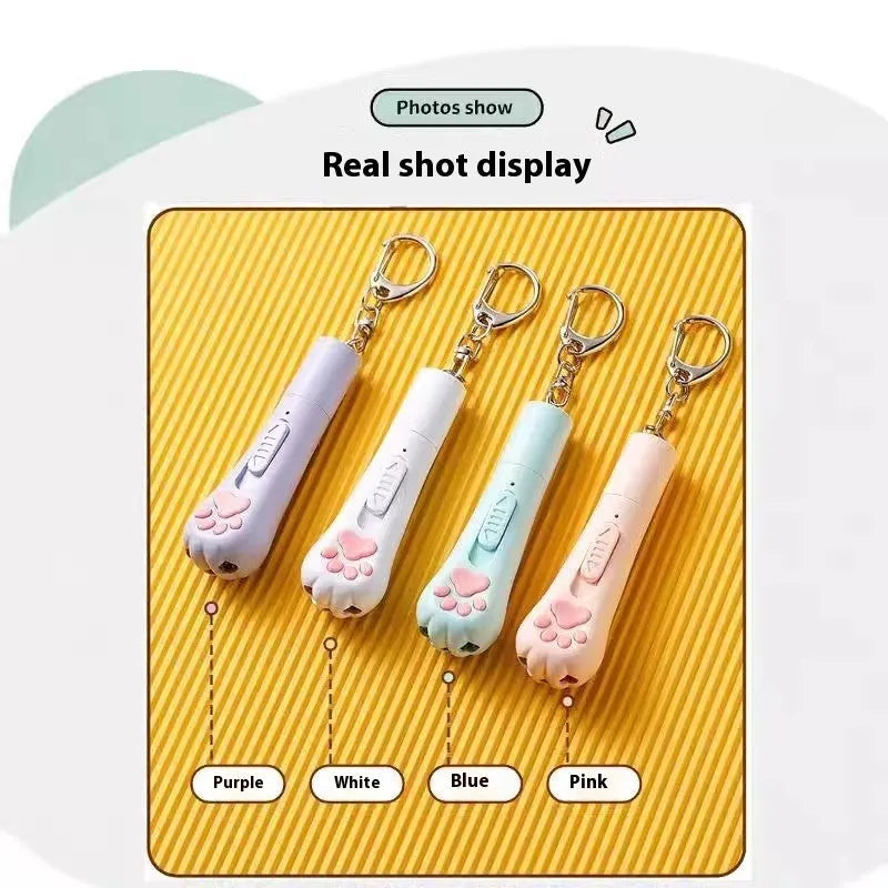 Charging cat teaser pet toy with pen light in cream white, pink, or sky blue.