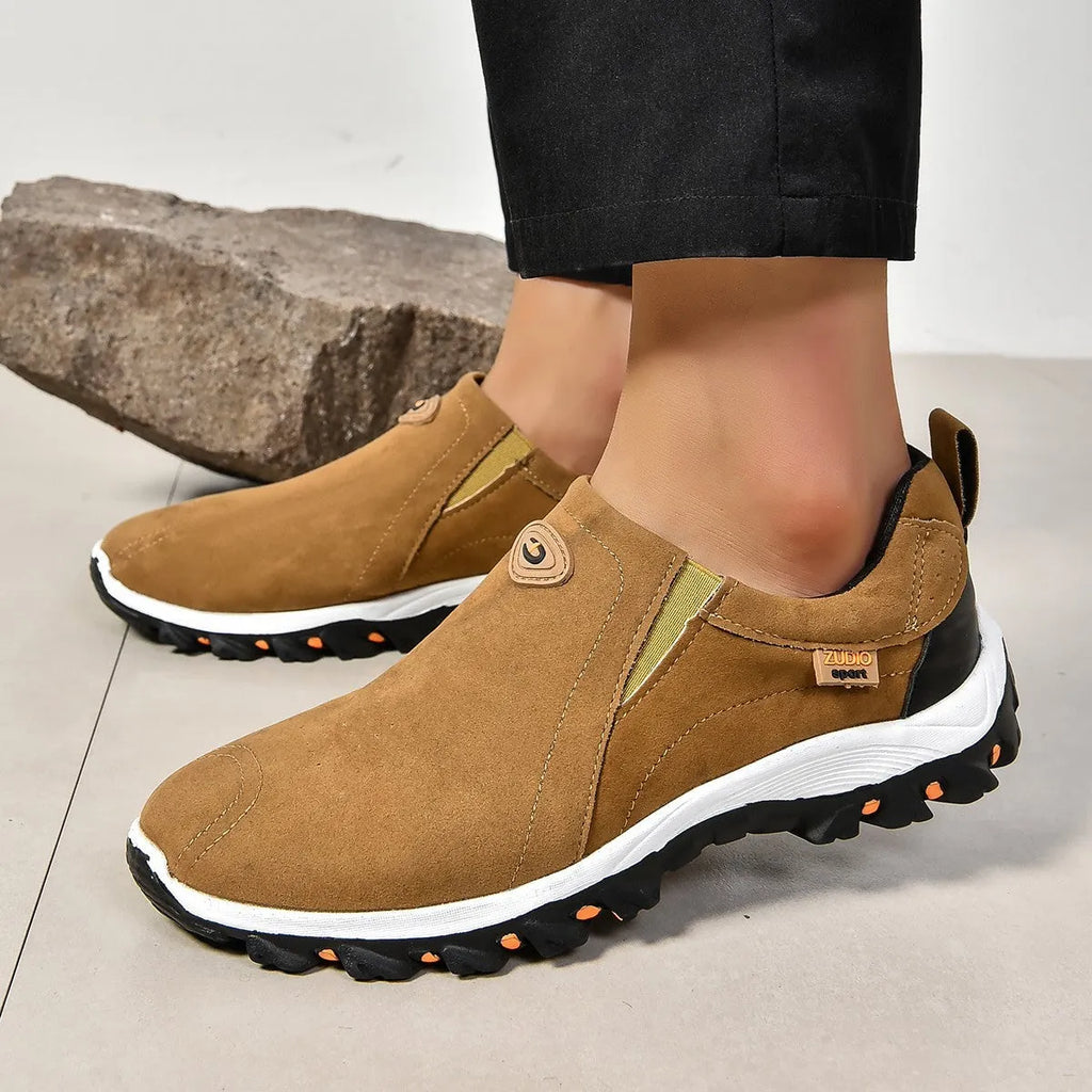 Men's grey PU slip-on overshoes with a round toe and rubber sole, shown on a foot.