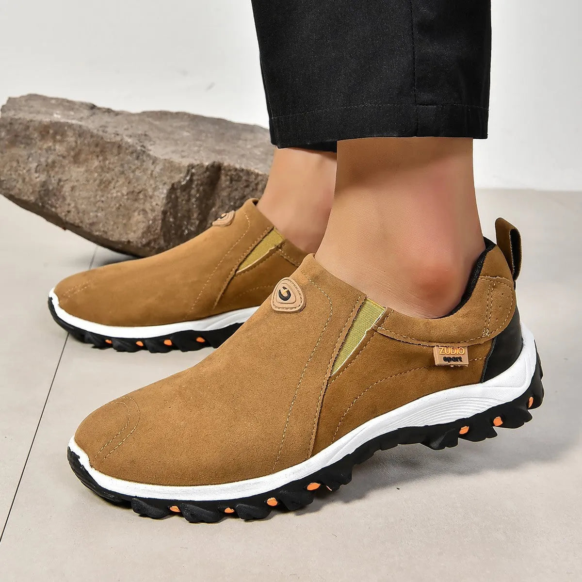 Men's grey PU slip-on overshoes with a round toe and rubber sole, shown on a foot.