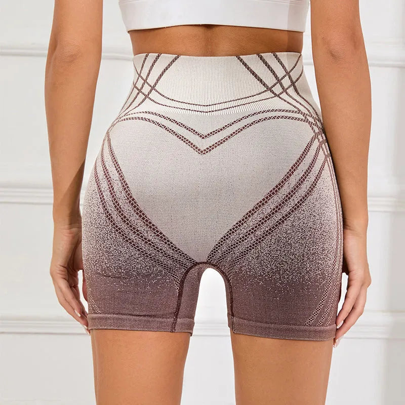 Women's high waisted gradient fitness shorts in black, suitable for running and yoga.