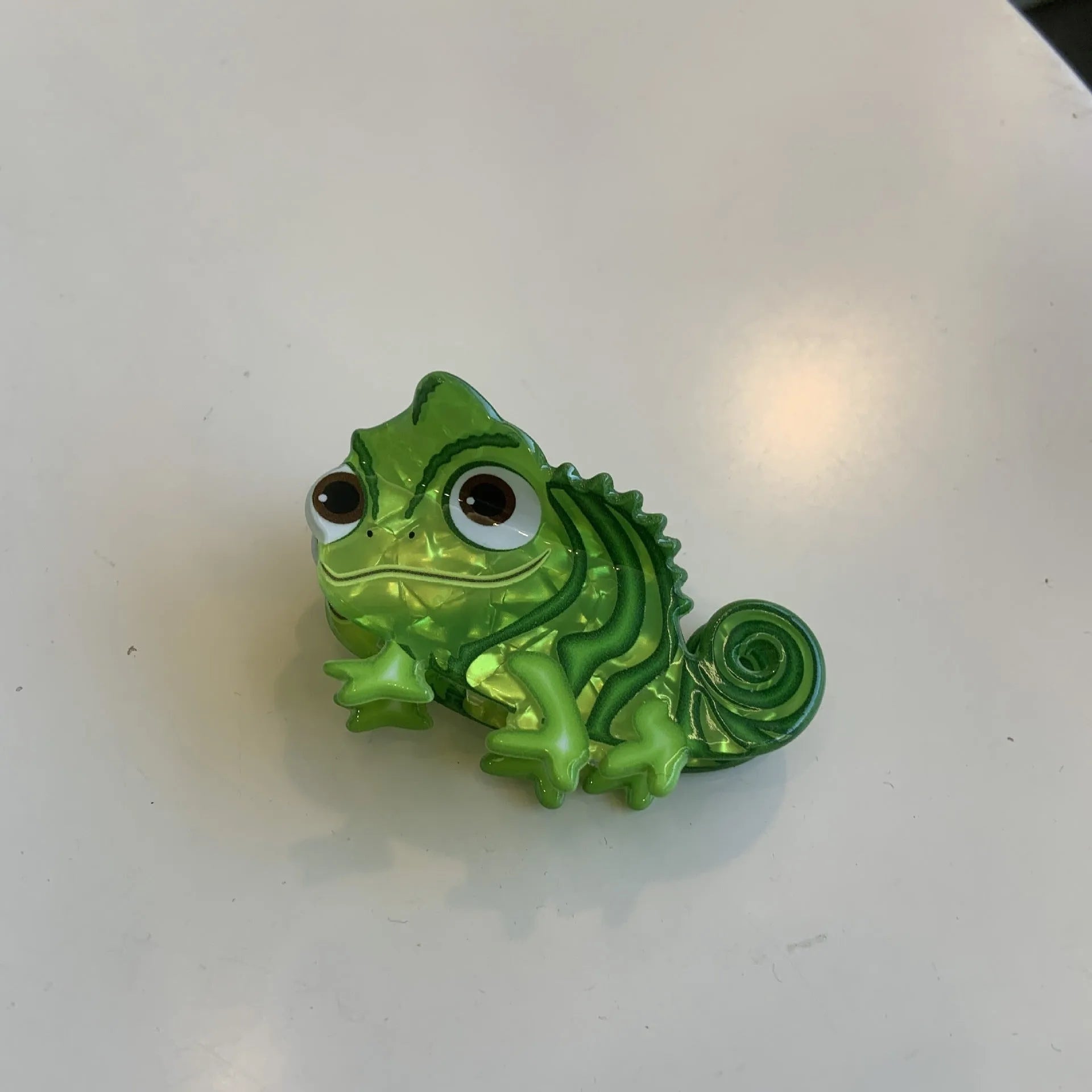 Colourful dinosaur acrylic jaw hair grip clip showing six design variations