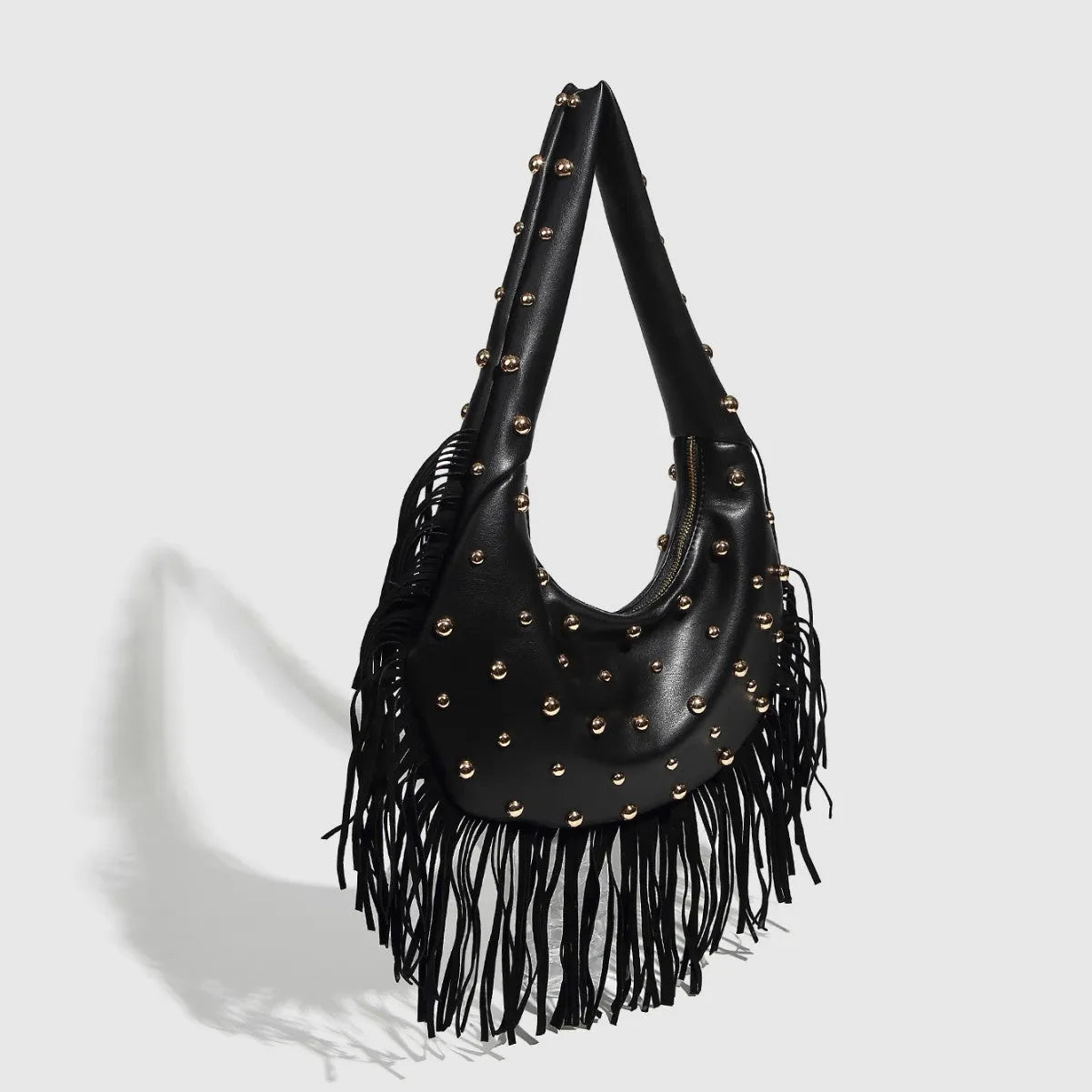Retro black shoulder handbag with decorative tassel and internal mobile phone pocket