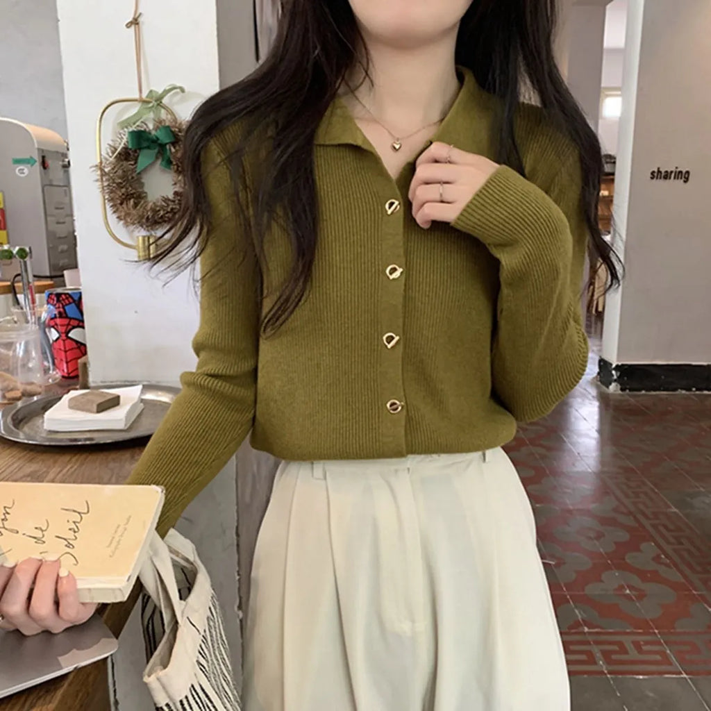 Beige loose fit long-sleeved viscose knitted cardigan top worn open as a layer.