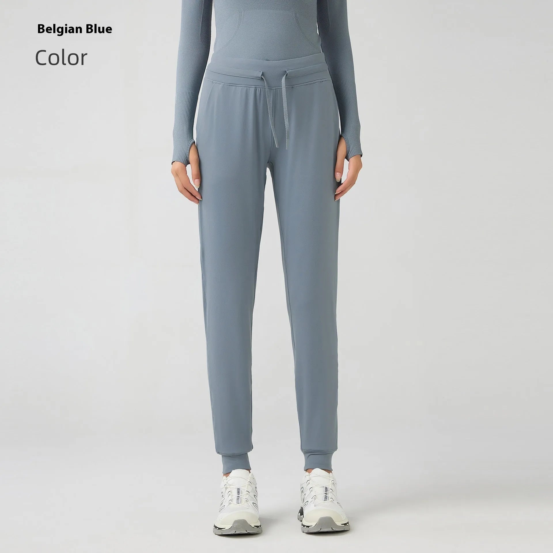 Women's high-waist yoga pants with drawstring waistband in a cotton blend fabric.