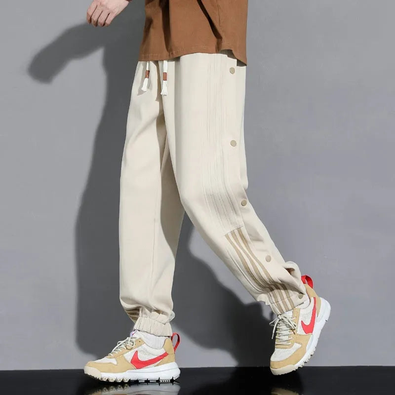 Men's loose grey sweatpants with ankle ties and belt, cotton blend fabric for autumn sports wear