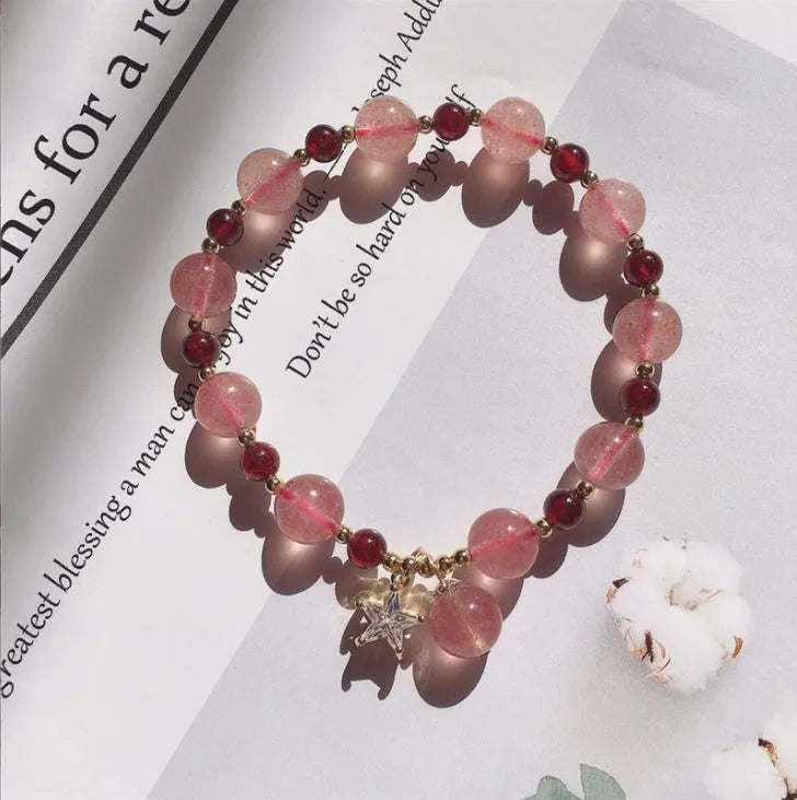 Handmade natural crystal bracelet with strawberry quartz decorative elements in pearl, moon, XINGX, or green design options