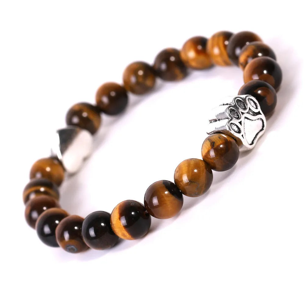 Tigereye Indian Agate stone bracelet with dog paw and love heart charms on wrist.