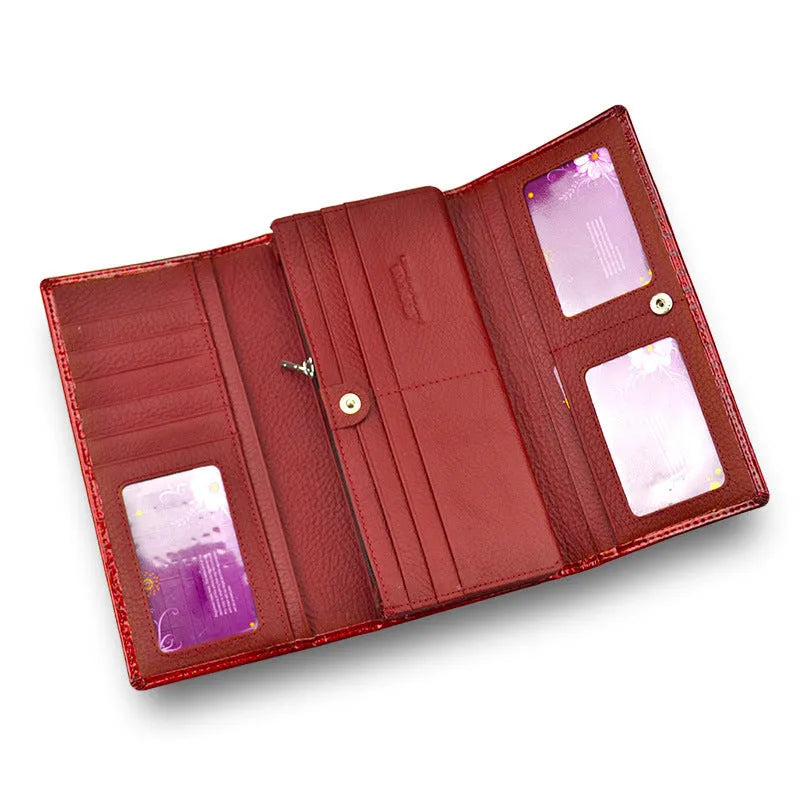 Wine red women's leather coin purse with a shiny crocodile pattern texture and open interior.