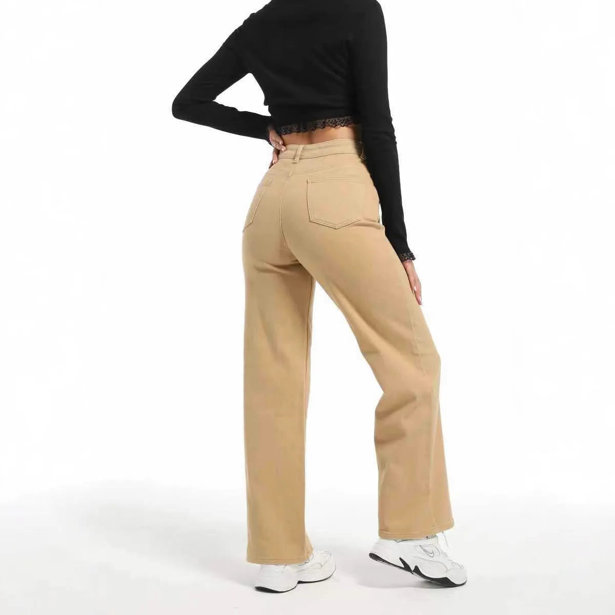 Women's apricot straight wide-leg high-waisted cotton trousers on a hanger.