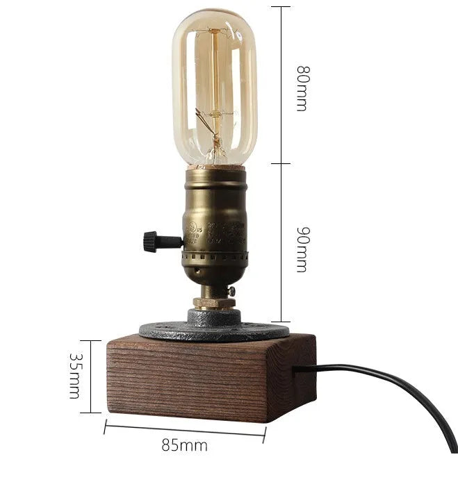 Small wooden and iron water pipe shaped table lamp on a table