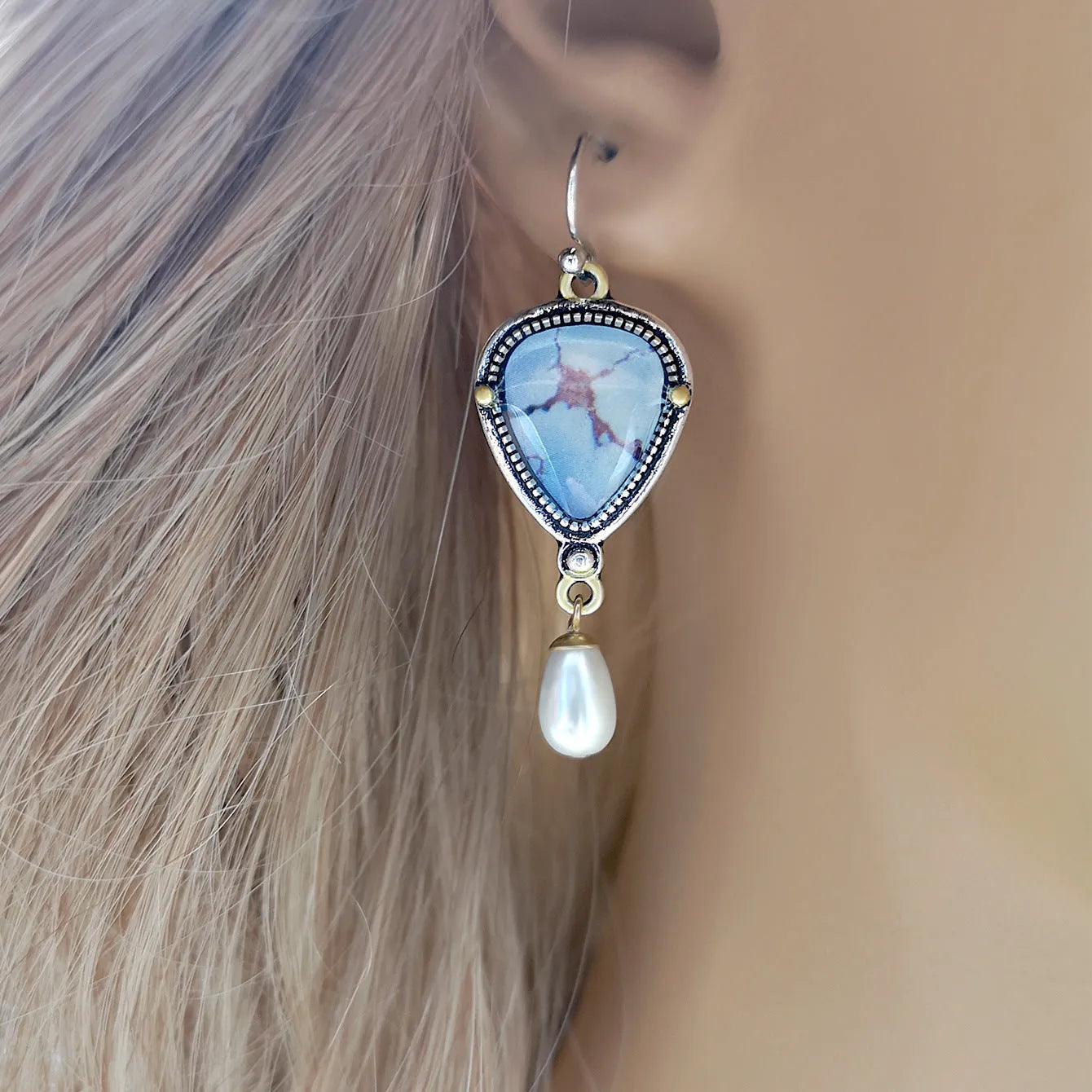 Retro blue geometric drop earrings with synthetic opal and pearl details on a two-tone electroplated metal setting.