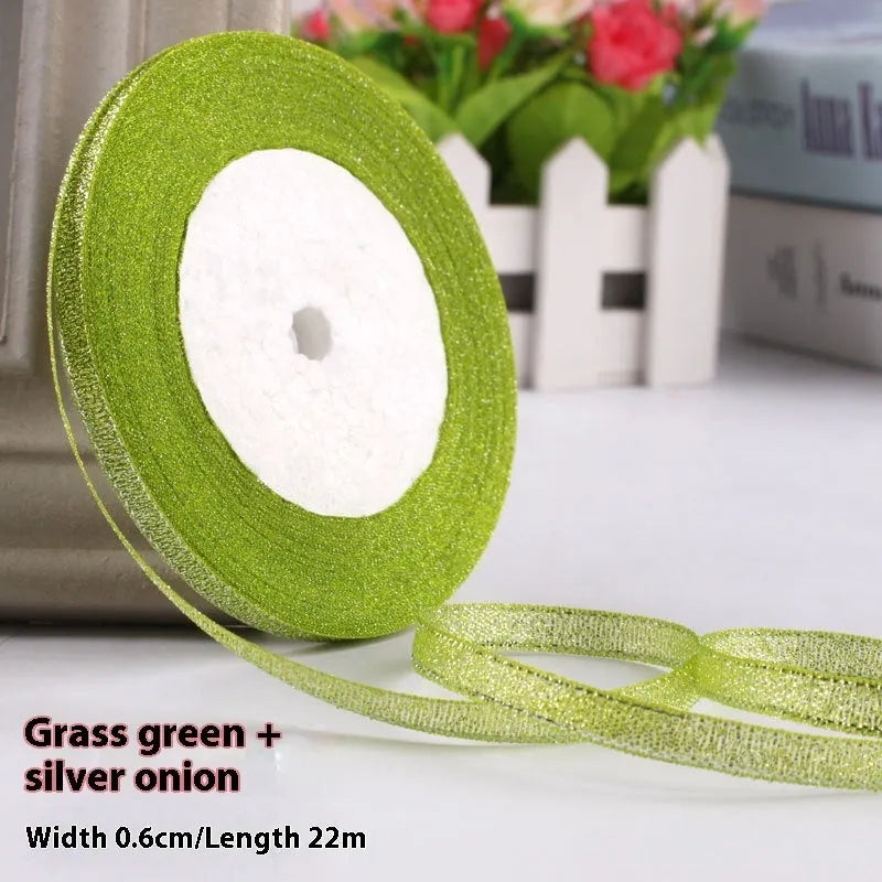 Roll of narrow 0.6cm wide polyester satin ribbon in a choice of colours, showing 22 metre length.