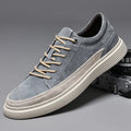 Men's grey and sand coloured low-top casual skate shoes with round toe and lace-up front.