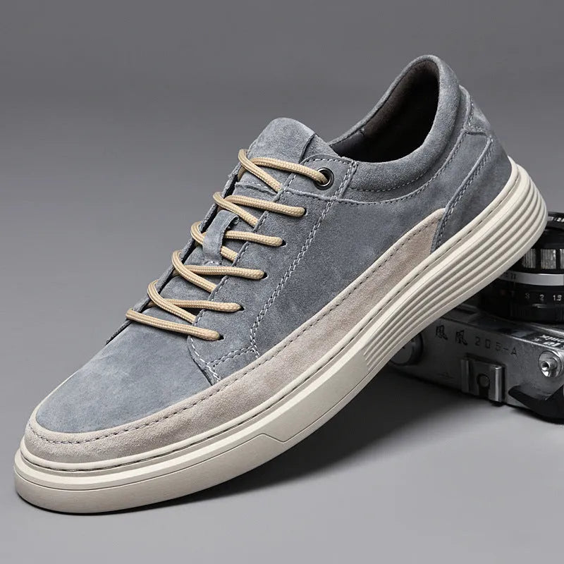 Men's grey and sand coloured low-top casual skate shoes with round toe and lace-up front.