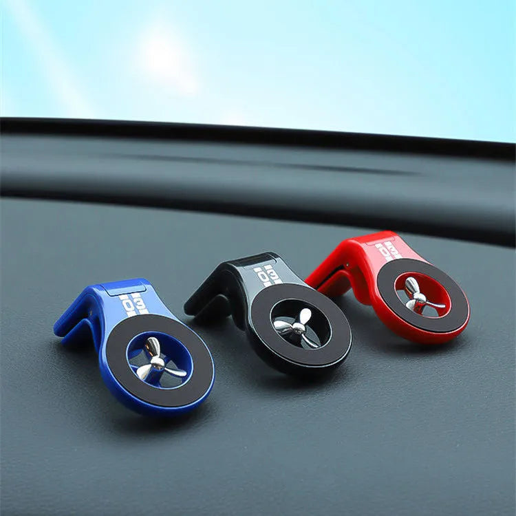 Magnetic car phone holder mounted on car air vent with smartphone attached