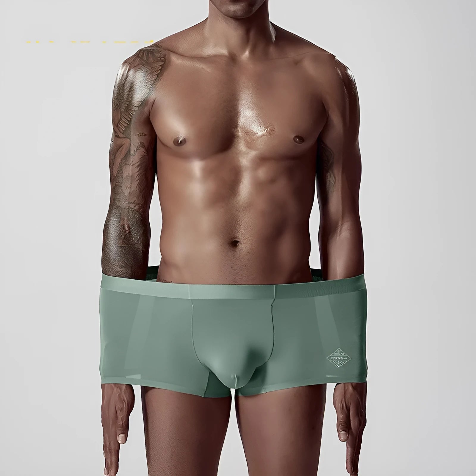Seamless modal men's underwear in green, pink, and white colours with mid-waist design