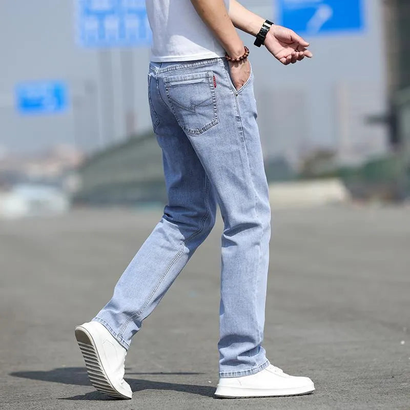Men's smoky gray straight leg jeans with low waist and zip fly made from elastic rabbit fur fabric