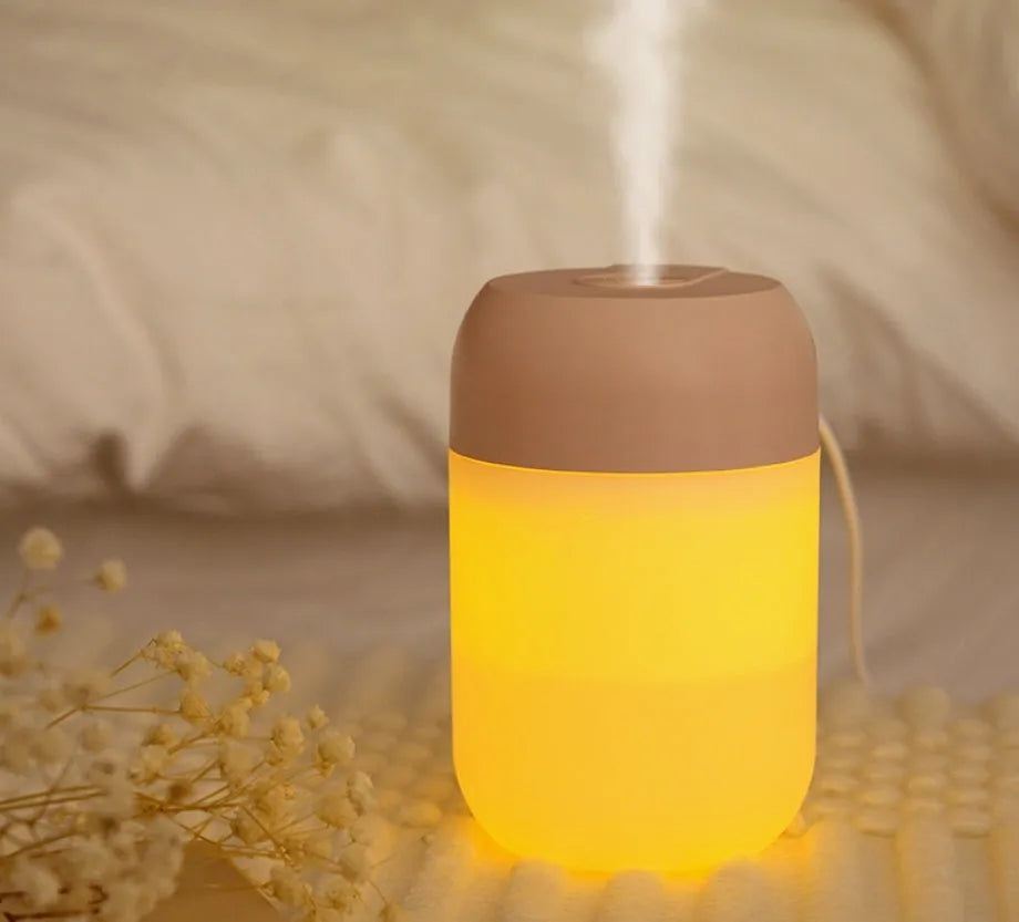 White cylindrical mini humidifier with USB port and aromatherapy function for small-space moisture control