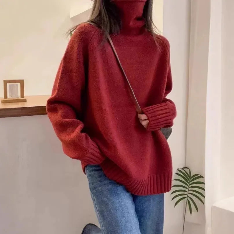 Women's loose-fit turtleneck sweater with a thick, textured curling pile collar in a grey solid colour.