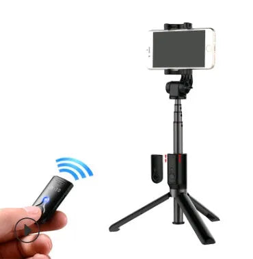 Aluminium alloy Bluetooth tripod selfie stick with remote control extended, holding a mobile phone.