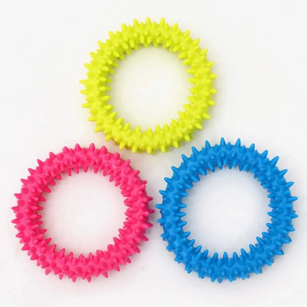 Blue TPR spiky ring dog chew toy with dental cleaning nubs on a white background