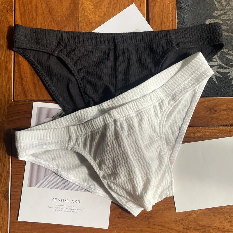 Men's solid colour cotton triangle underwear briefs in mid-waist design on a white background
