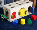 Wooden shape sorting lock box educational toy for preschool children with colourful shapes