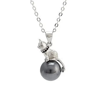 Close-up of a sterling silver cat silhouette pendant on a clavicle-length chain.
