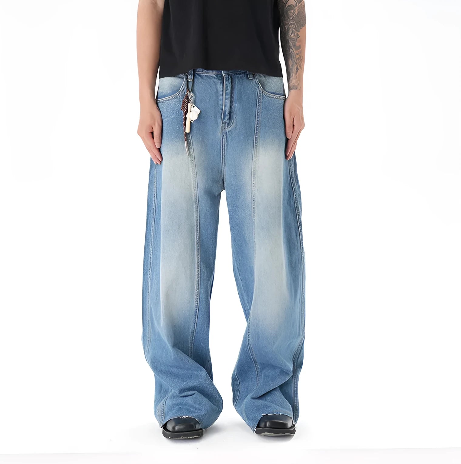 Light blue washed vintage women's wide leg jeans with a machete cut design on a front zip fly.