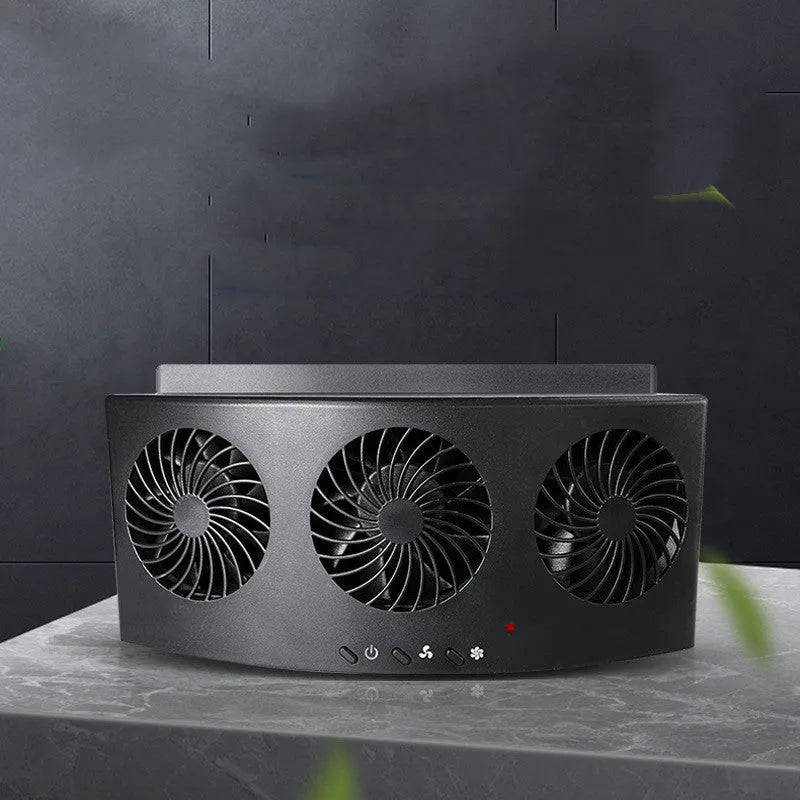Black and white portable USB-powered car ventilation fan on a car dashboard.