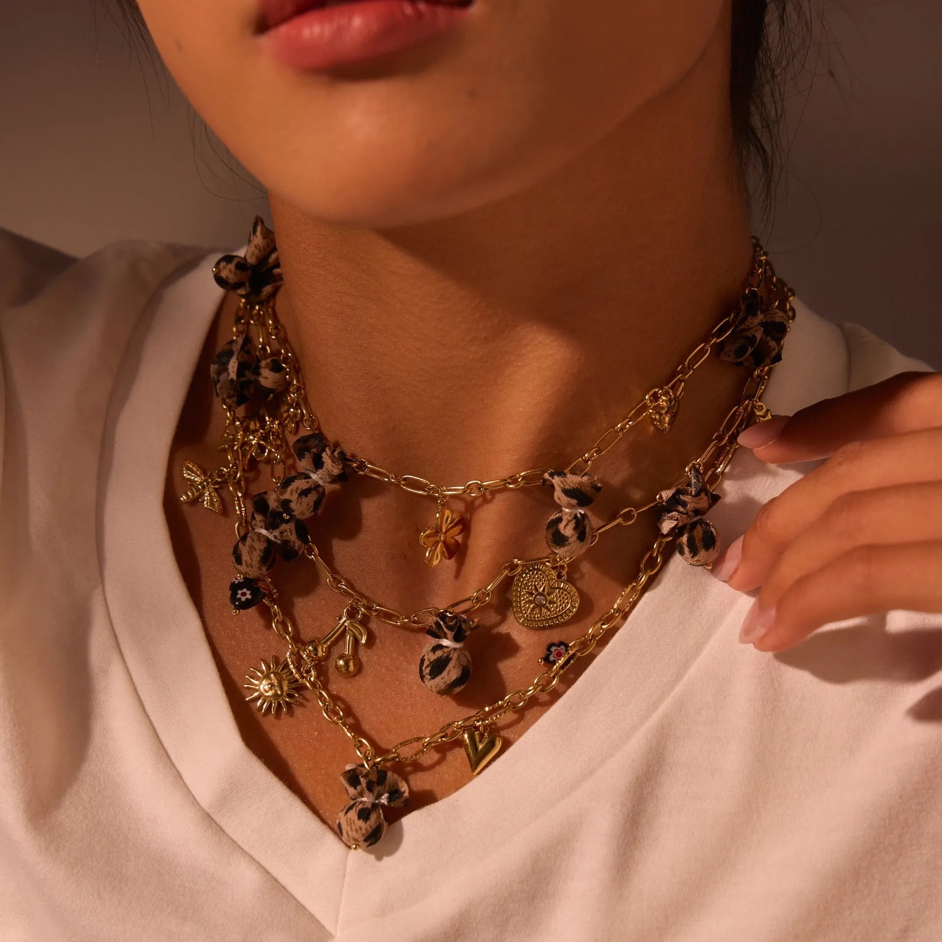 Women's stainless steel leopard pendant necklace with love heart and flower details on 41-50cm adjustable chain
