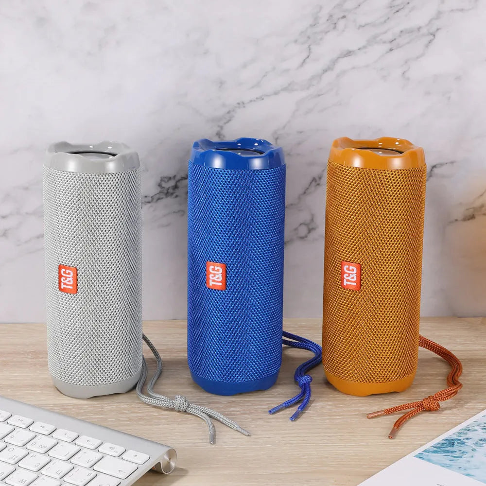 Fabric-covered portable Bluetooth speaker with integrated card holder slot in blue colour