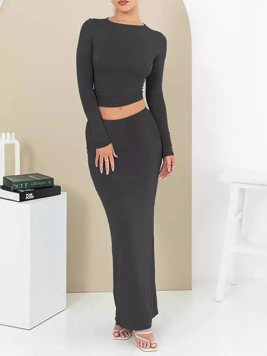 Women's black sweet style polyester two-piece suit with exposed navel and three-quarter sleeves.