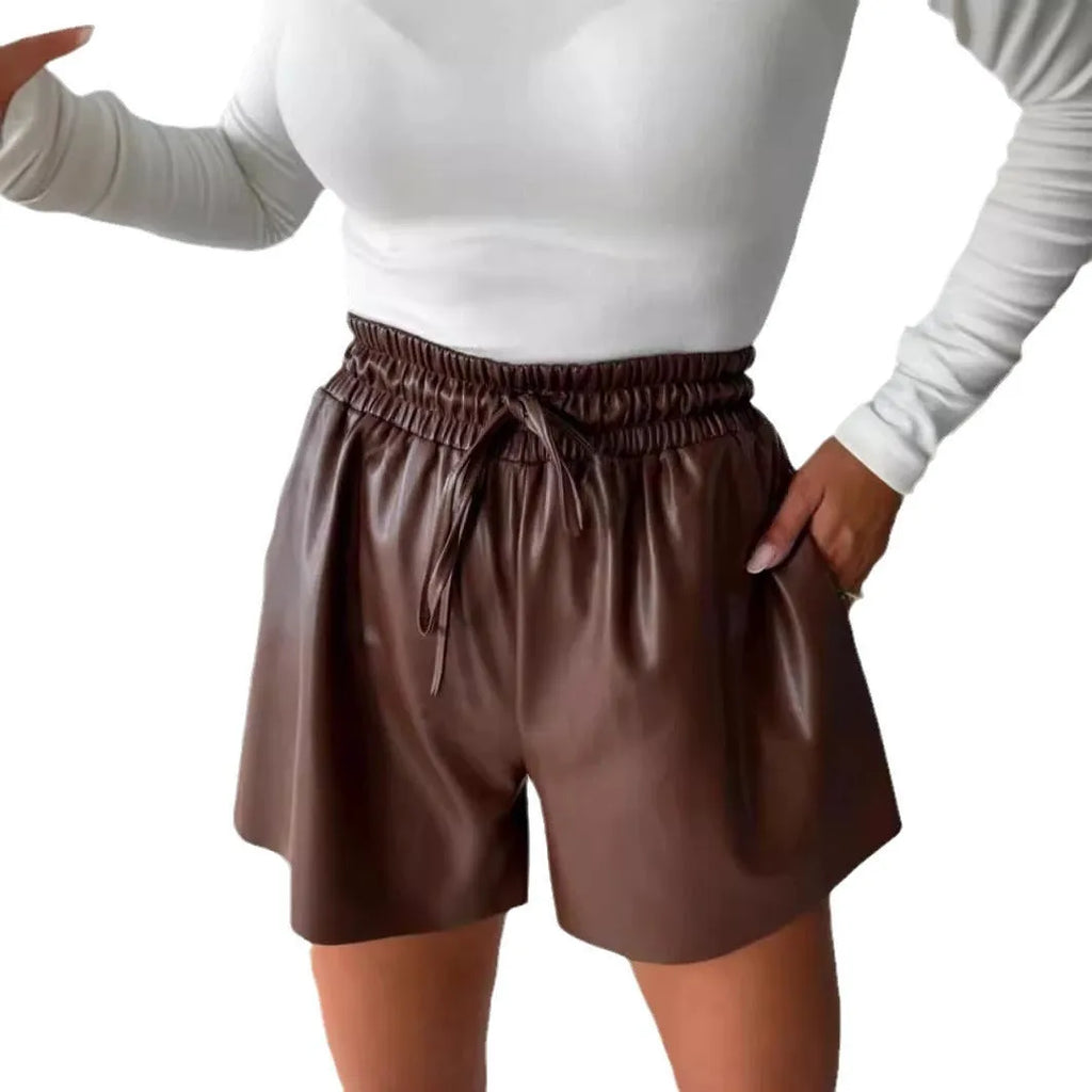 Women's black lace-up drawstring wide-leg shorts with a mid-waist and straight-leg design.