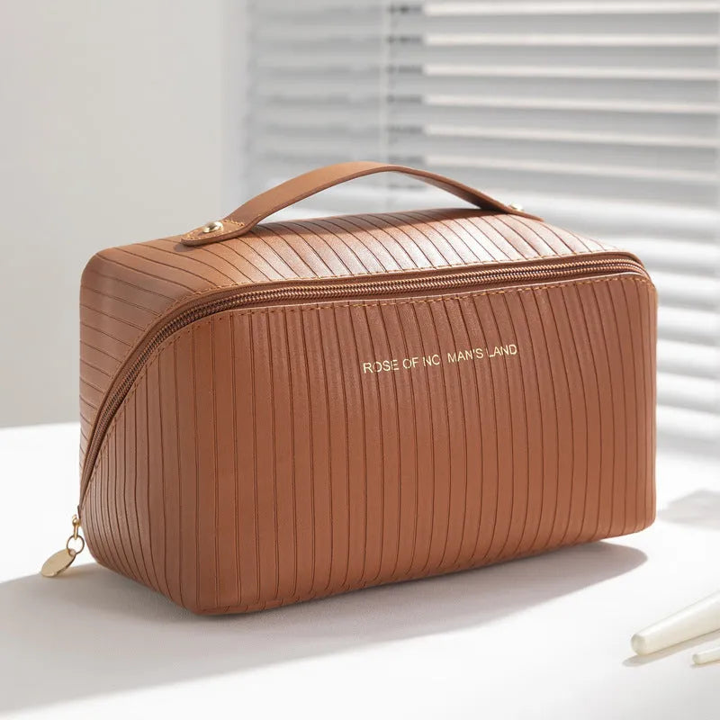 Cubic pillow makeup bag with vertical pattern in five colour options showing 22.5cm dimensions