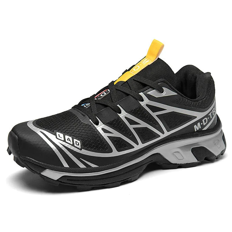 Low-top hiking shoes in khaki with rubber soles and front lace-up closure.