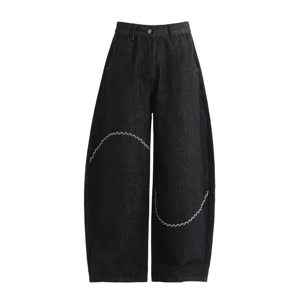 Men's black straight-leg jeans with a mid waist and zip fly, shown laid flat.