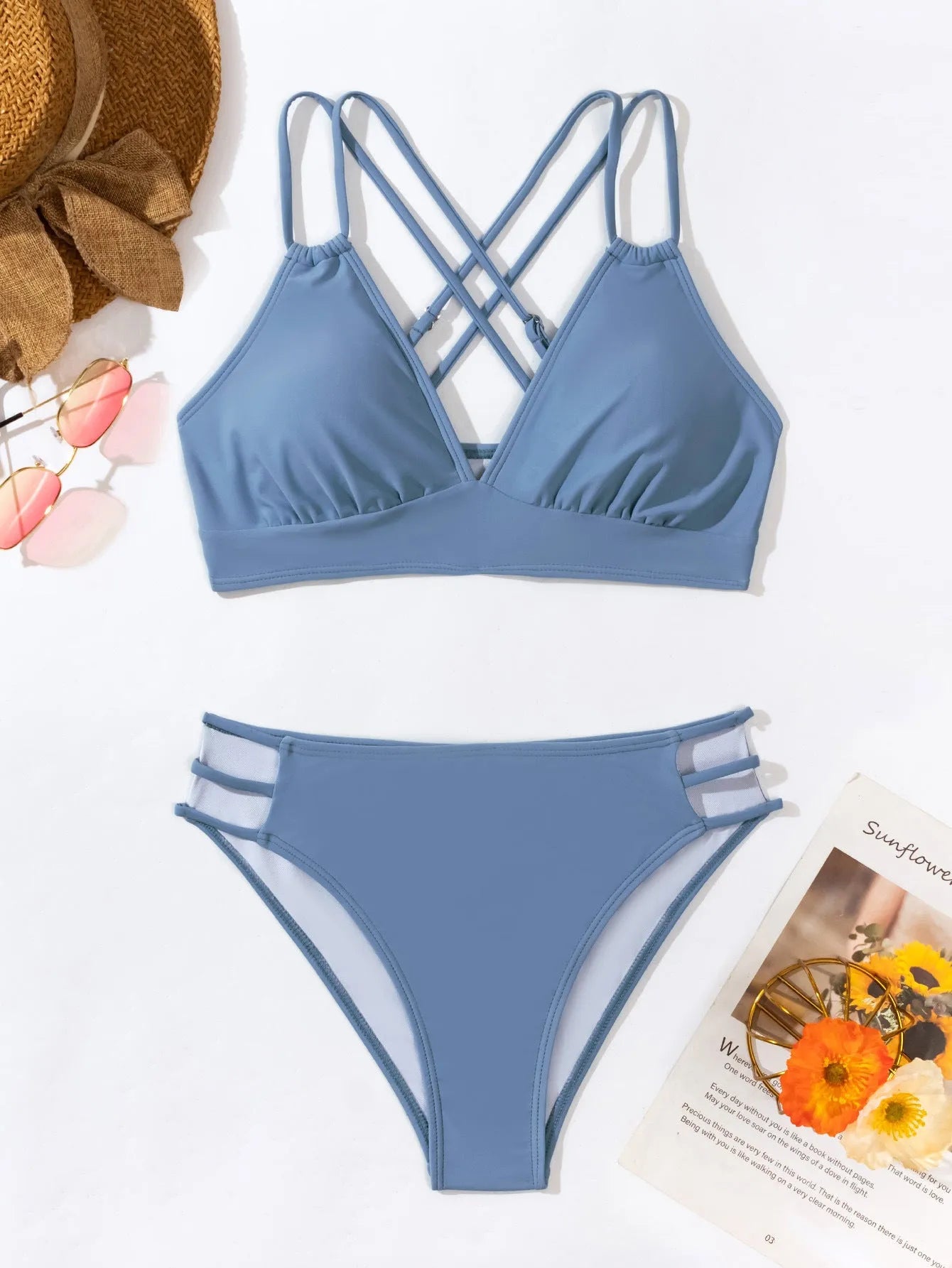 Women's black V-neck halter bikini with split leg shorts on a mannequin.