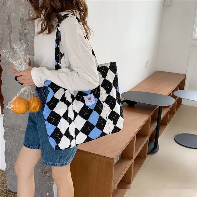 Large capacity Oxford cloth shoulder bag for women with a three-dimensional front pocket.