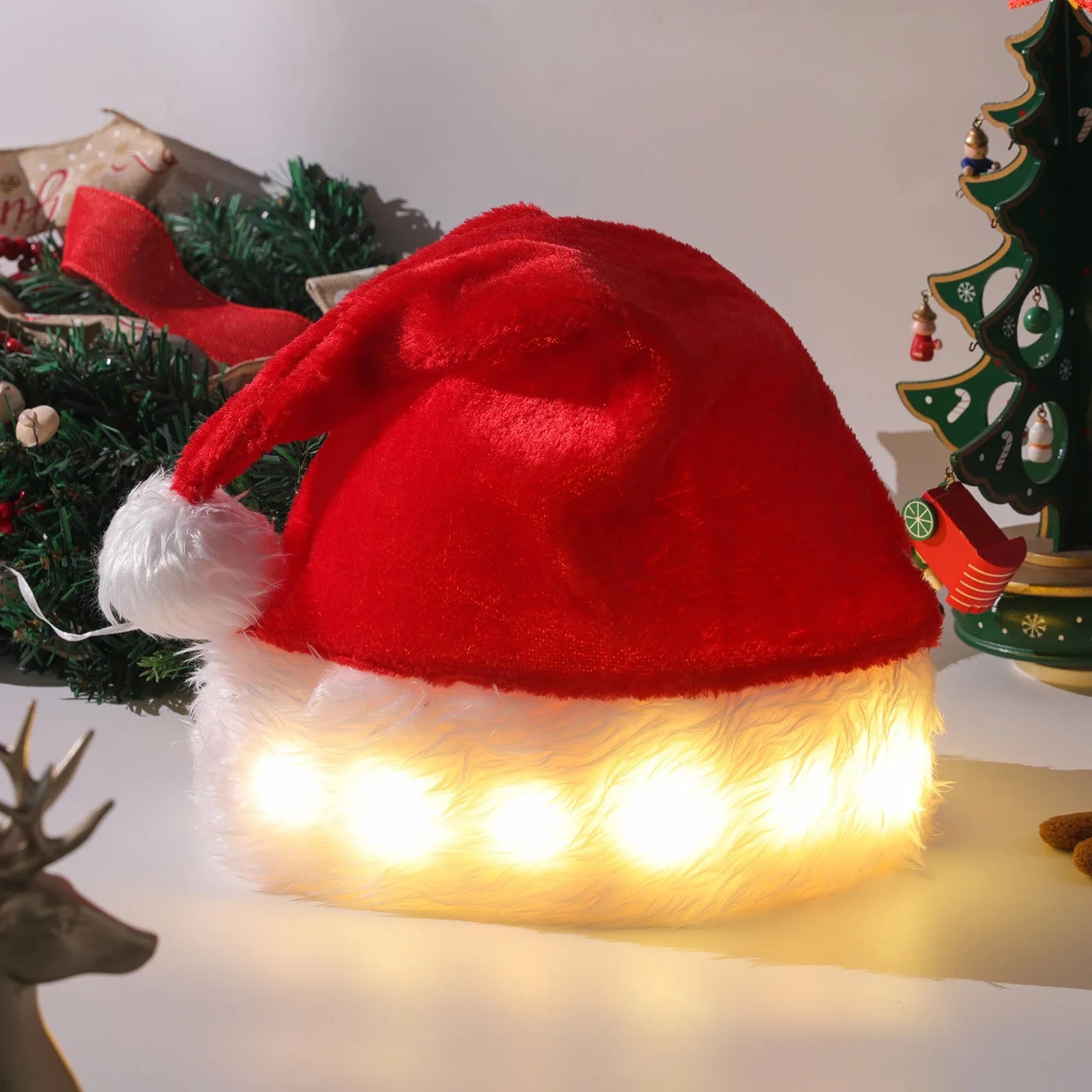Red and white LED light up Santa hat with colour changing lights and a white pom-pom.