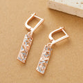 Rectangular two-tone hollow stud earrings with geometric design and electroplated alloy construction