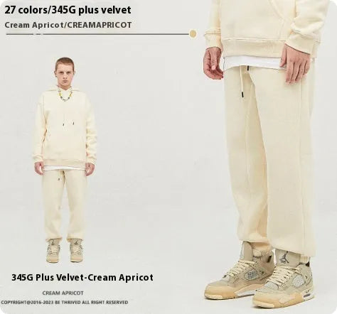 Men's solid colour cotton velvet casual sweatpants with elasticated waist and ankle cuffs.