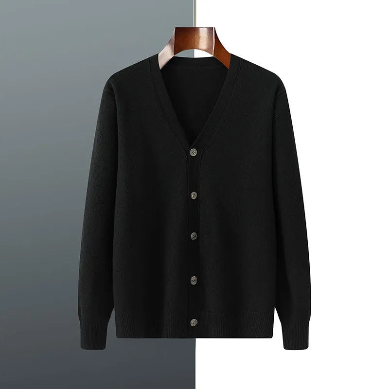 Man wearing a beige V-neck Andy velvet cardigan coat with a loose fit and long sleeves.
