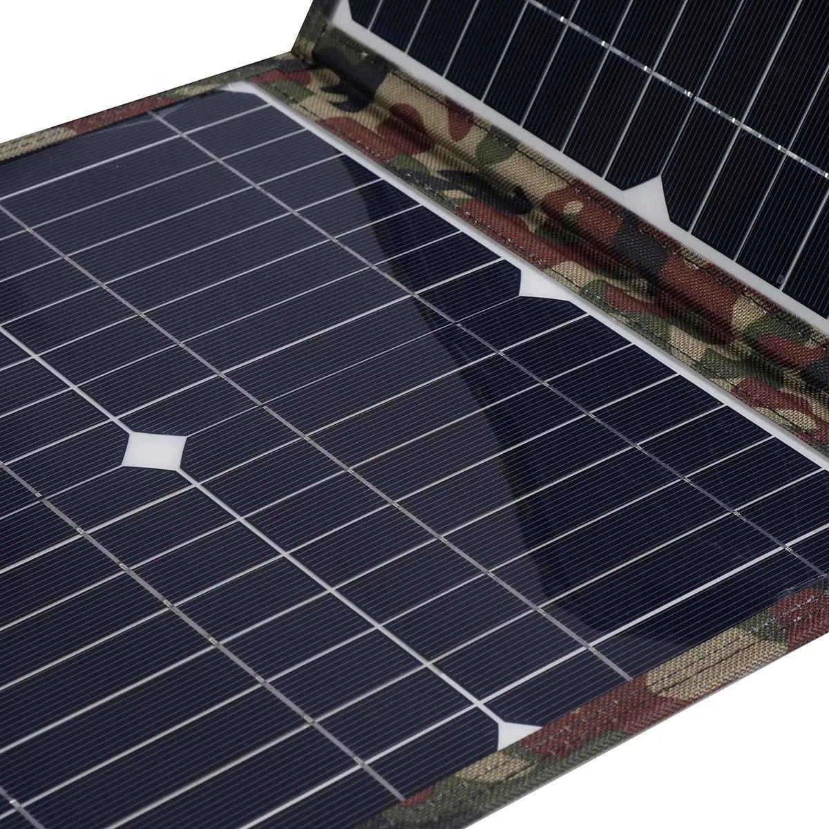 Black foldable solar panel unfolded showing three monocrystalline solar cells, with accessories including car charger and USB box
