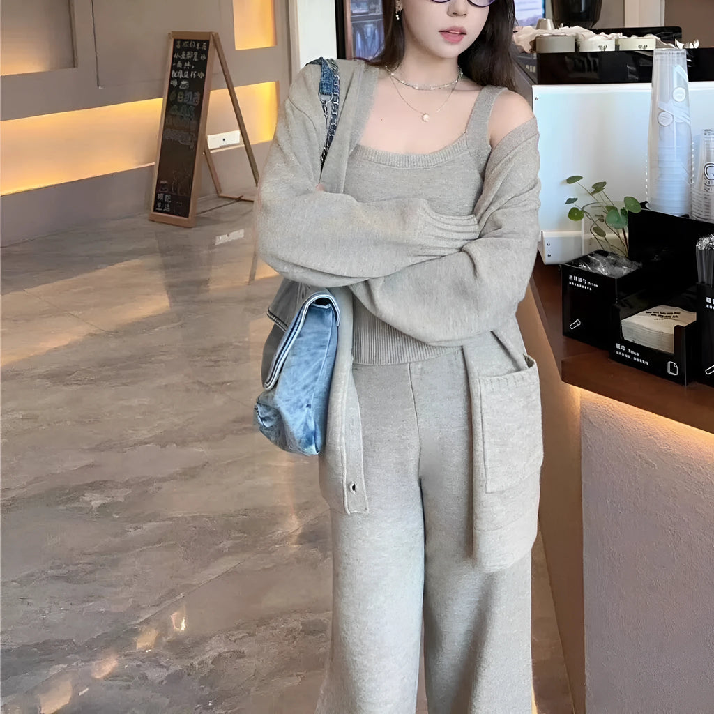 Women's loose fit knit cardigan, vest, and casual pants three-piece set in a solid colour.
