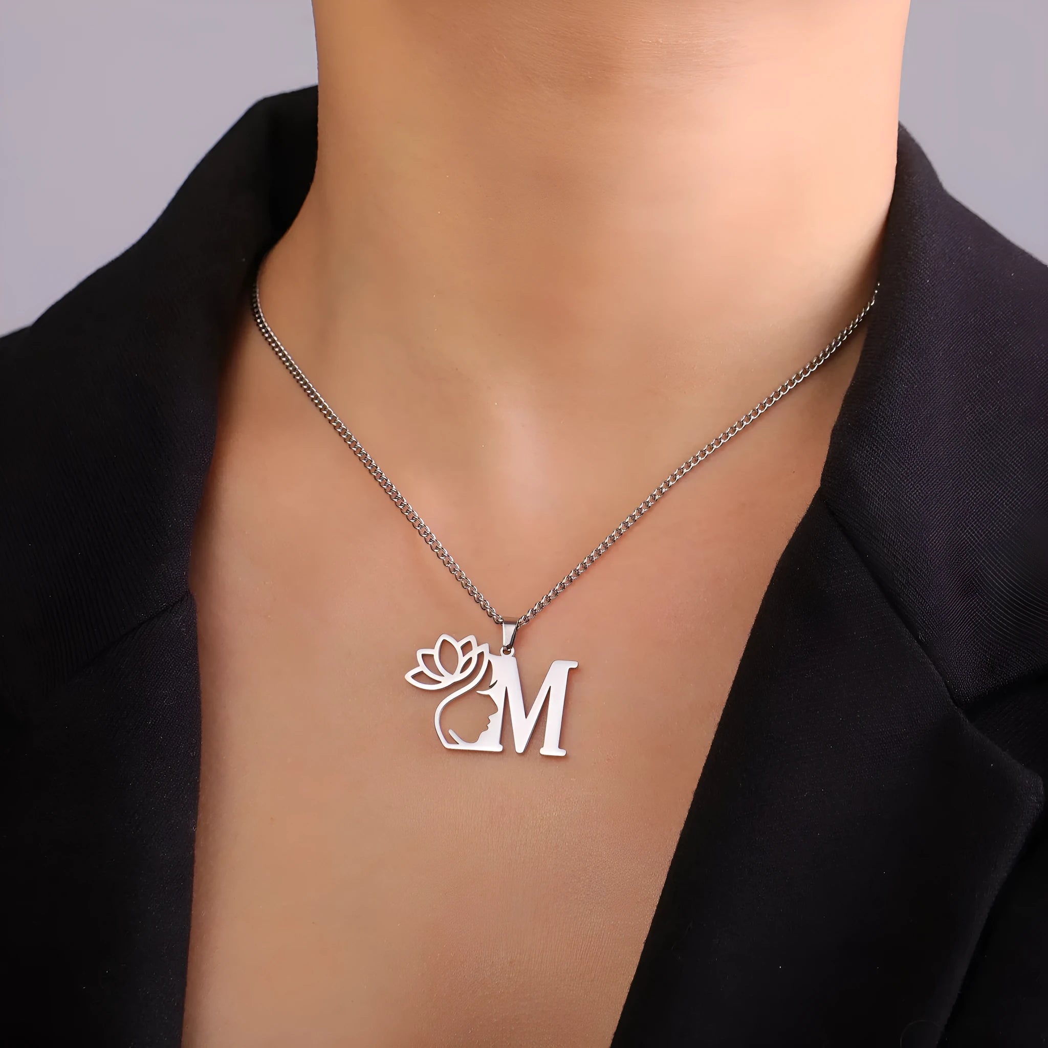 Stainless steel necklace with cross chain design and single letter pendant in gold or silver electroplated finish