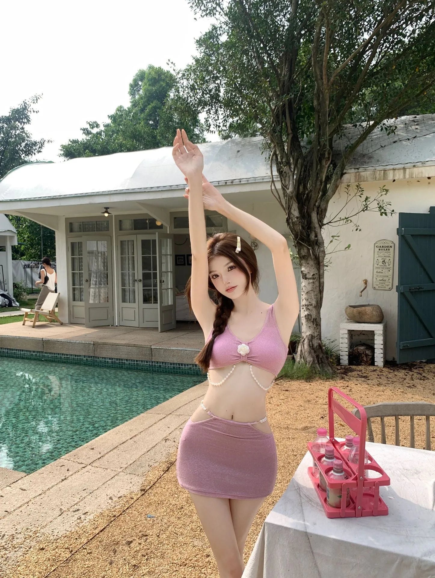 Women's pink and black polyester three-piece bikini swimsuit with high elasticity construction