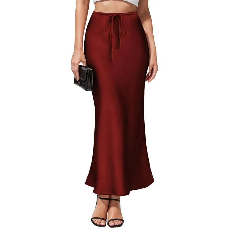 Women's high-waist asymmetric acetate skirt in black showing irregular hem detail